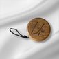 Elegant wooden yo-yo made of oiled oak and black cord with loop