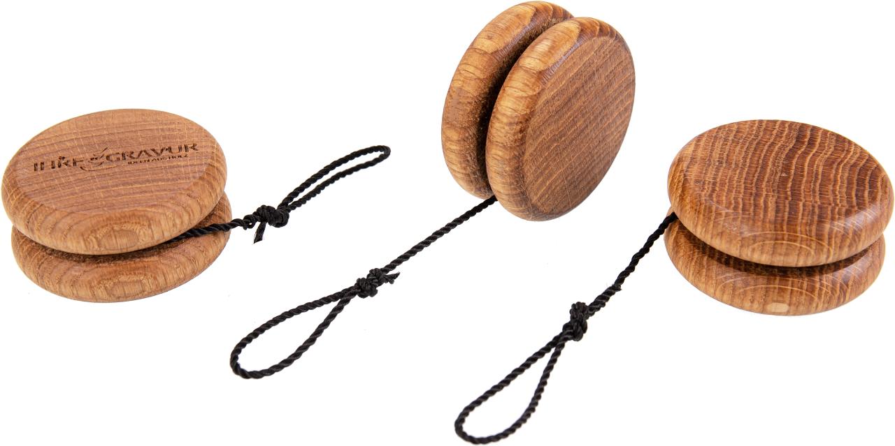 Elegant wooden yo-yo made of oiled oak and black cord with loop